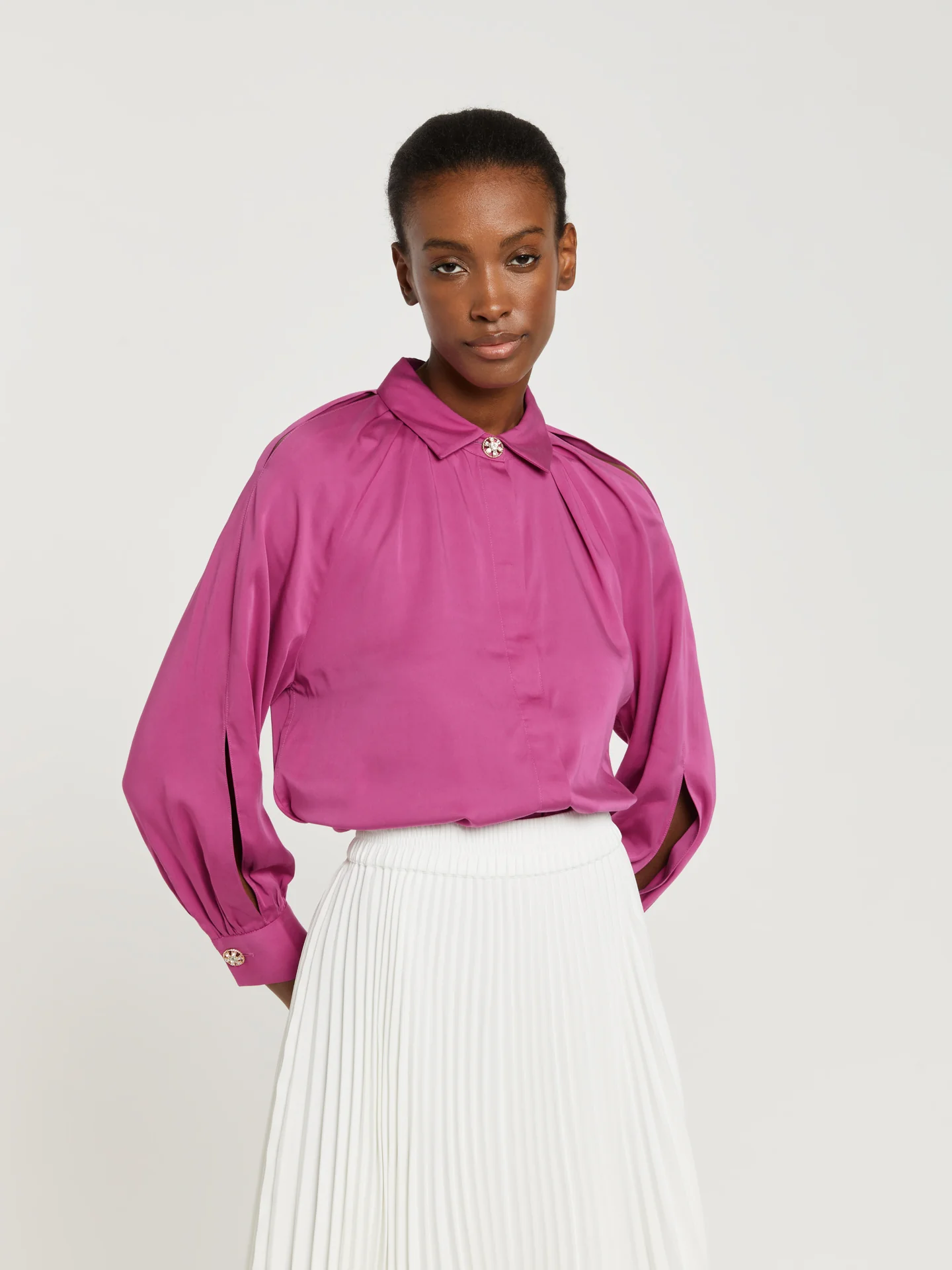 Blouse with sleeves openings